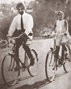 Cyling with his daughter Asha