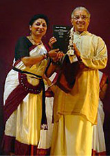 Malathi Iyengar presented a copy of her book Dance and Devotion to Bharatanatyam guru V P Dhananjayan 