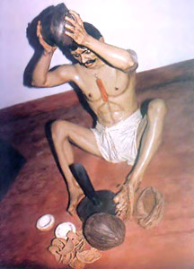 Husking and opening coconuts - Manual Labour in Cellular Jail, Andaman And Nicobar Islands