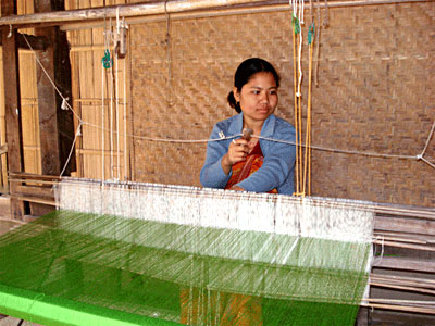Woman in Assam weaving to contrinute to the family`s  total income - Women in Indian Villages, Indian Village Society